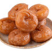 Badusha on a ceramic plate with a white background