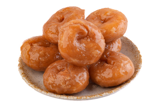 Badusha on a ceramic plate with a white background